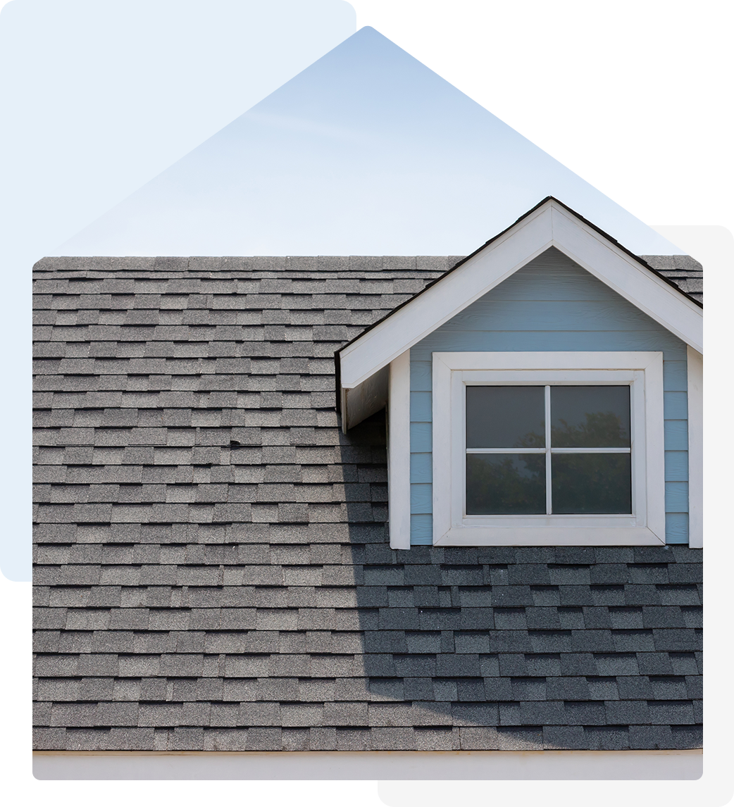 Here's an alt tag for the image: Grey asphalt shingle roof, dormer window.